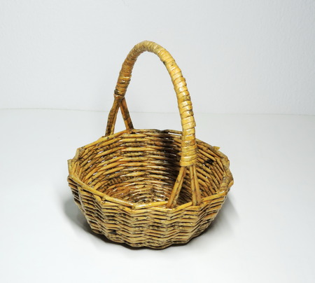 A cute handmade basket made of newspapers paper.の写真素材