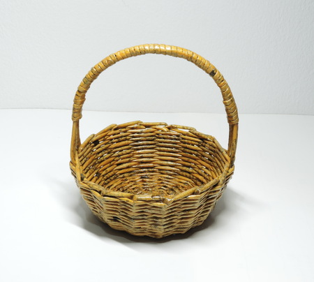 A cute handmade basket made of newspapers paper.の写真素材