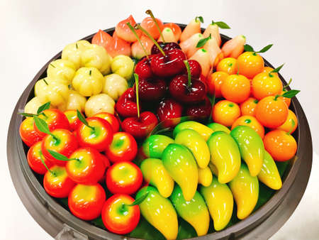 Tray of fruit shaped mung beans or Kanom look choup in Thailand.の写真素材