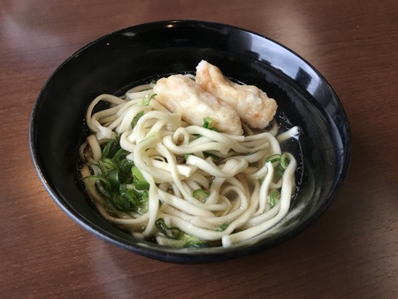 Udon served with kamaboko or fish cake in Okinawa, Japan.の写真素材
