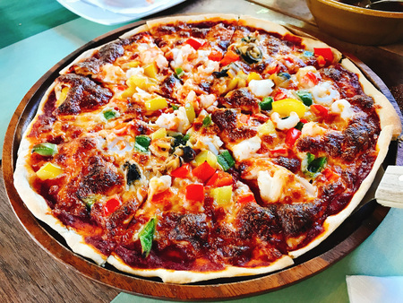 Thin & crispy hawaiian pizza.の写真素材