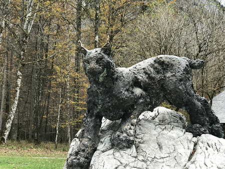 Berchtesgaden, Germany - November 1, 2018:  Figure tiger sculpture is standing on the rock, the artwork near St.Bartholomew's Church at the shore of the Konigsee Lake in Berchtesgaden, Germany.のeditorial素材