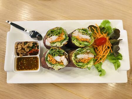 Dish of yummy Shrimp morning salad rolls.