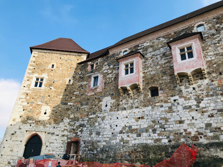 Ljubljana, Slovenia - November 8, 2018:  Part of enormous stone wall of Ljubljana Castle. The castle is a key landmark of the town and is today used as a major cultural venue.のeditorial素材