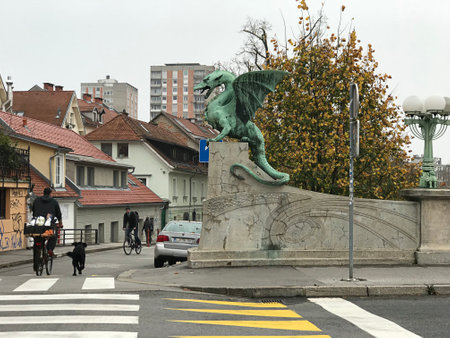 Ljubljana, Slovenia - November 5, 2018:  The sheet-copper winged dragon statues of the Dragon Bridge, which is now a symbol of Ljubljana in Slovenia.のeditorial素材