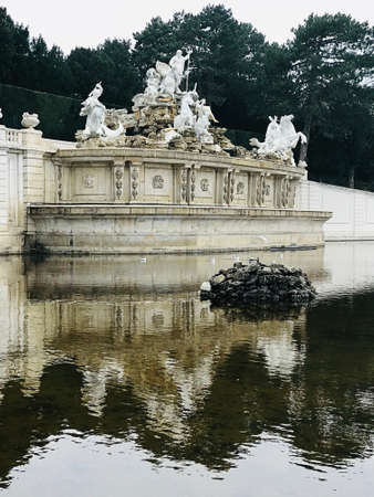 Vienna, Austria - November 10, 2018:  The Neptune Fountain at the foot of the Gloriette hill was designed to be the crowning monument of the Great Parterre. Commissioned by Maria Theresa in the 1770s.のeditorial素材