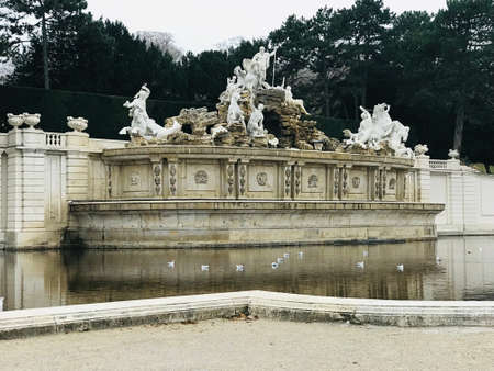 Vienna, Austria - November 10, 2018:  The Neptune Fountain at the foot of the Gloriette hill was designed to be the crowning monument of the Great Parterre. Commissioned by Maria Theresa in the 1770s.のeditorial素材