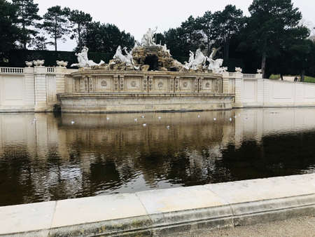 Vienna, Austria - November 10, 2018:  The Neptune Fountain at the foot of the Gloriette hill was designed to be the crowning monument of the Great Parterre. Commissioned by Maria Theresa in the 1770s.のeditorial素材