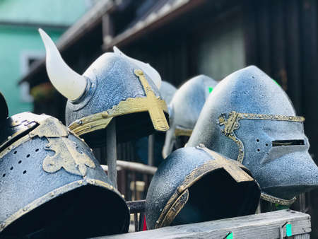 Trakai, Lithuania - September 14, 2019:  A variety of warrior hats made of metal are on sale on the...