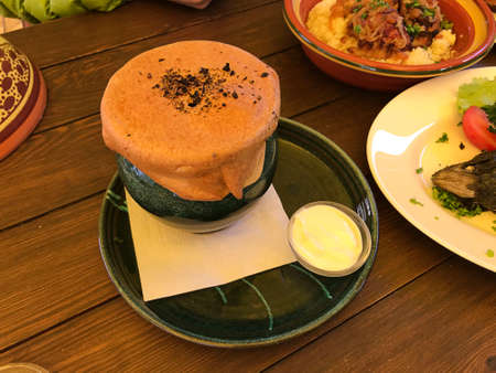 Chicken meat with vegetables in crockery in Trakai, Lithuania.