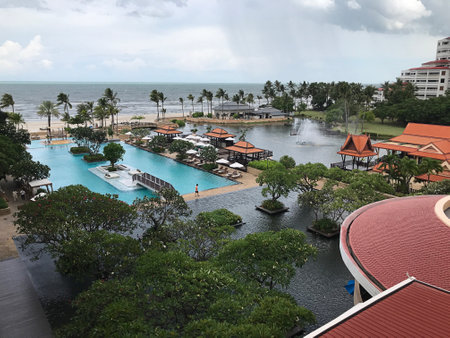 Prachuab Khiri Khan, Thailand - August 26, 2022: Scenery surrounding of the swimming pool of Dusit Thani Hua Hin Hotel in Thailand.のeditorial素材