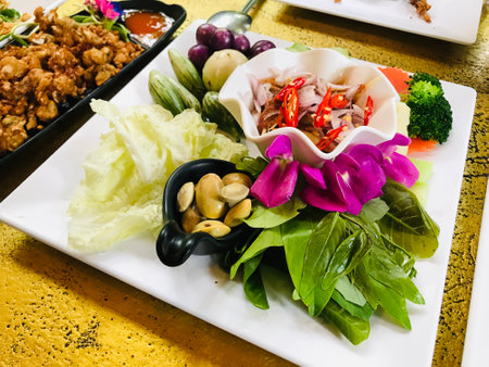 Shrimp paste chili sauce with green mango served with various vegetable in Phuket, Thailand.の写真素材