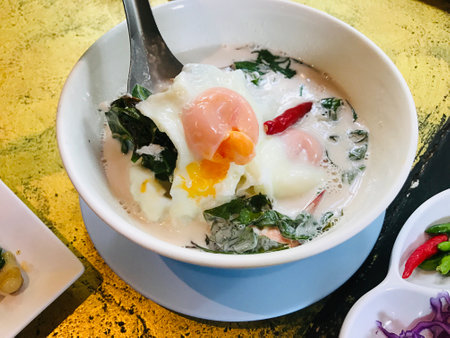 Steamed coconut milk with Gnetum gnemon or "Meong" vegetable in Phuket, Thailand.の写真素材