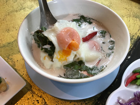 Steamed coconut milk with Gnetum gnemon or "Meong" vegetable in Phuket, Thailand.の写真素材