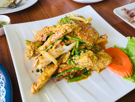 Stir-Fried Crab with yellow curry powder and egg in Phuket, Thailand.の写真素材