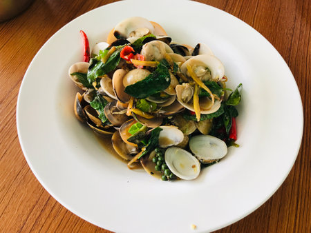 Stir-fried spicy clams with Thai herb in Phuket, Thailand.の写真素材