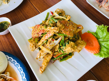 Stir-Fried Crab with yellow curry powder and egg in Phuket, Thailand.の写真素材