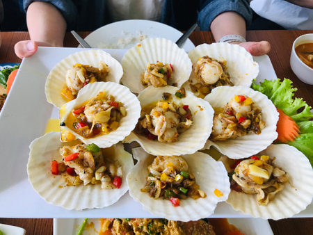 Baked Scallops with butter and garlic in Phuket, Thailand.の写真素材