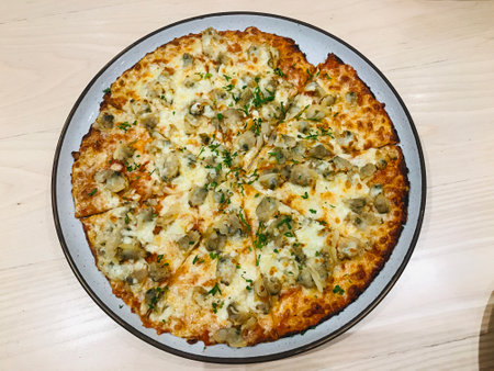 Pizza topped with clams and garlic butter in Thailand.の写真素材
