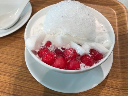 Thai ice dessert "Tubtim krob or Mock pomegranate seeds with creamy coconut in coconut ice syrup".の写真素材