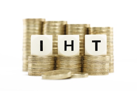 IIHT  Inheritance Tax  on gold coins with white backgroundの写真素材