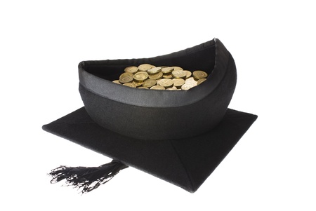 Education Costs - Mortar Board Graduation Cap Full of Coinsの写真素材