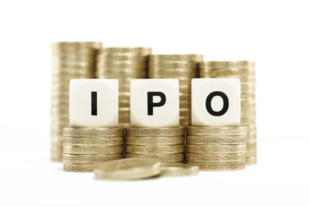 IPO  Initial Public Offering  on gold coins on white backgroundの写真素材
