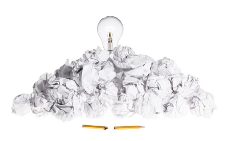 Problem Solving Concept Light Bulb On Pile of Crumpled Paperの写真素材