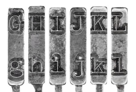 Old Typewriter Typebar Letters G to L Isolated on Whiteの写真素材