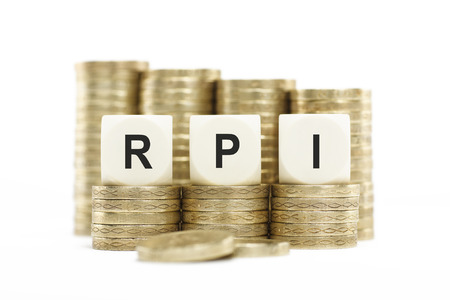 RPI  Retail Price Index  on Coin Stacks Isolated White Backgroundの写真素材