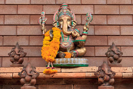 golden ganesha on brick wallの写真素材