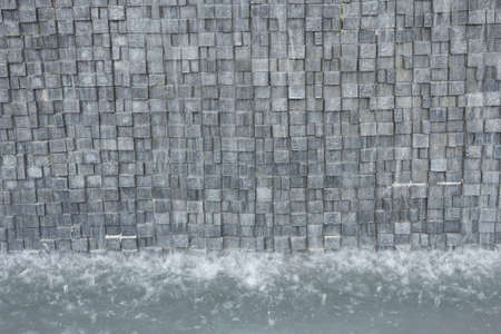 falling water from the artificial waterfallの写真素材
