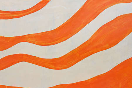 orange paint stripes on the white concrete wallの写真素材