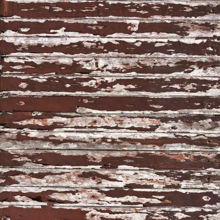 brown peeling paint on old wood backgroundの写真素材