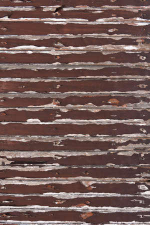 brown peeling paint on old wood backgroundの写真素材