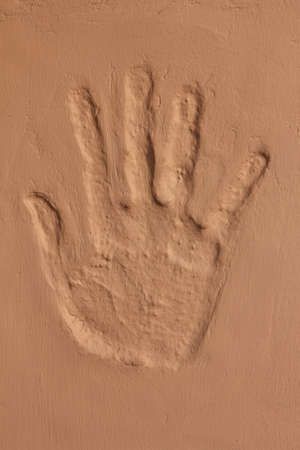 hand imprint on concrete wallの写真素材