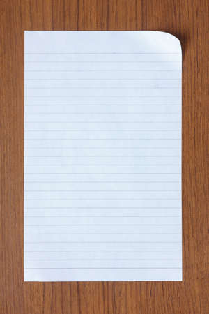 blank white paper on old wood backgroundの写真素材