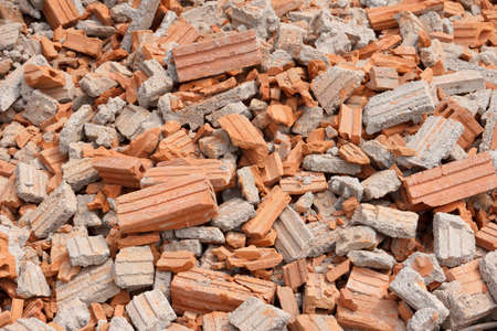 pile of collapsed red bricks wall