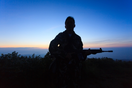 Silhouette of a soldier with twilight background