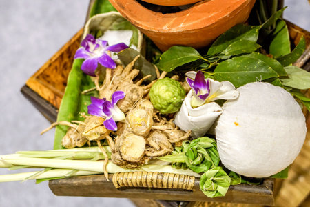 Top view of Herbal spa balls and many Thai herbs for treatment or massage in Thai spa.の写真素材