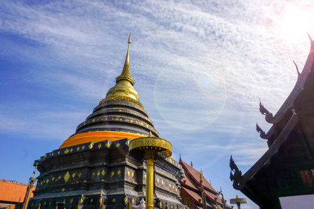 The enormous pagoda and golden Buddhist temple of Lanna art in Wat Phra That Lampang Luang is precious with ancient stucco art dating back over 1300 years.の写真素材