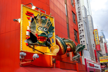 Osaka, Japan, January 16 2019 : Interesting Chinese restaurant sign in Chinese dragon shape at Shinsekai area. Shinsekai area is one of tourist popular destination in Osaka city.のeditorial素材