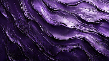 A captivating close-up of a rich purple textured surface featuring elegant wave patterns, showcasing a blend of glossy and matte finishes for an artistic flair.の素材