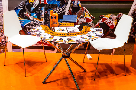 Winter 2015. Morning. Russia. Moscow. Crocus-Expo. Exhibition Motopark-2015 (BikePark-2015). Table with brochures near the exhibition stand.のeditorial素材