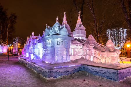 Winter 2014. December. Evening. Russia. Moscow. Center. Hermitage Garden. Russian educational Park: In the Cirlce of Family.  Ice sculpture: Terem. Fary tales of Pushkin.のeditorial素材