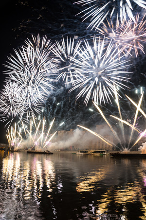 Russia. Moscow - September 26, 2015. The opening of the festival Circle Of Light 2015. Gorkiy Park. View of the complex of buildings of the Ministry of Defense during the show. Salute. Fireworks.のeditorial素材