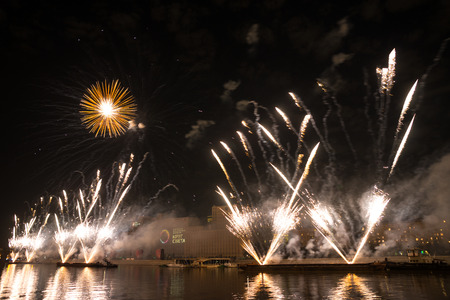 Russia. Moscow - September 26, 2015. The opening of the festival Circle Of Light 2015. Gorkiy Park. View of the complex of buildings of the Ministry of Defense during the show. Salute. Fireworks.のeditorial素材