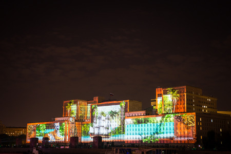 Russia. Moscow - September 26, 2015. The opening of the Festival Circle Of Light. Gorkiy Park. The complex of buildings of the Ministry of Defense and the Andreevskiy Bridge during the Show.のeditorial素材