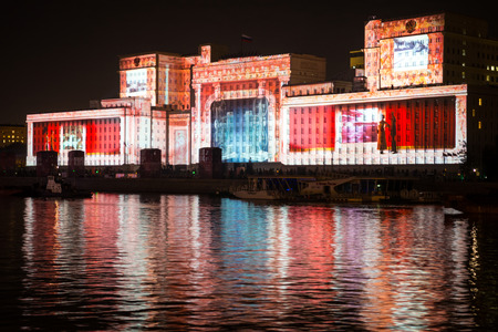 Russia. Moscow - September 26, 2015. The opening of the Festival Circle Of Light. Gorkiy Park. The complex of buildings of the Ministry of Defense and the Andreevskiy Bridge during the Show.のeditorial素材