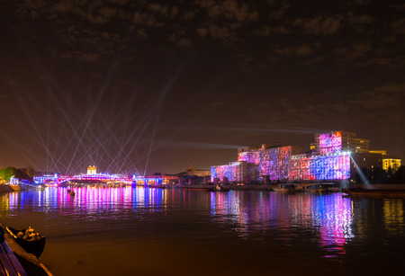 Russia. Moscow - September 26, 2015. The opening of the Festival Circle Of Light. Gorkiy Park. The complex of buildings of the Ministry of Defense and the Andreevskiy Bridge during the Show.のeditorial素材